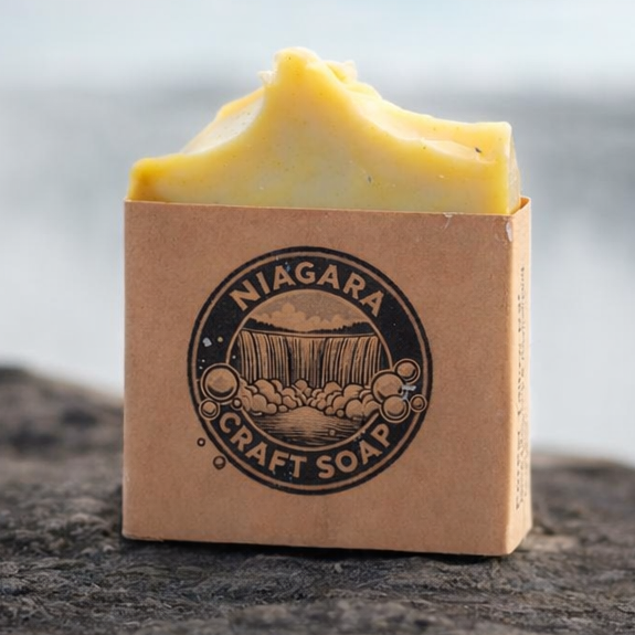 Block of soap with a visible brand logo on a rock with a blurred natural background