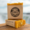 Niagara Craft Soap bar with packaging on a wooden surface