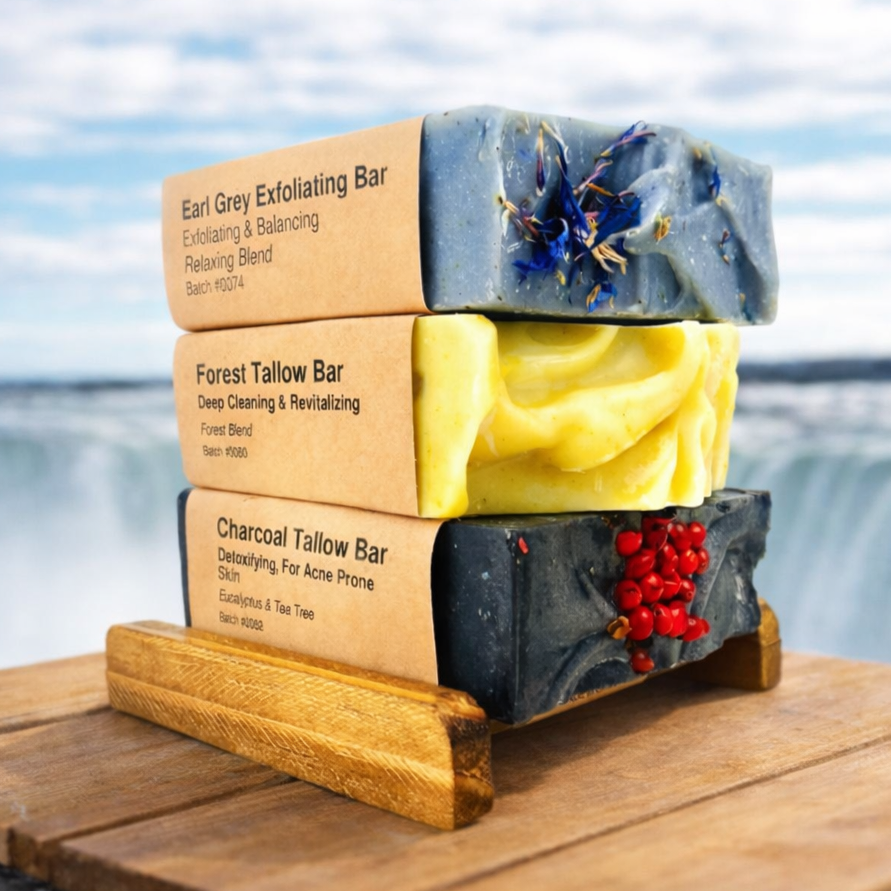 Stack of soap bars with visible branding on a wooden platform by a scenic waterfront.