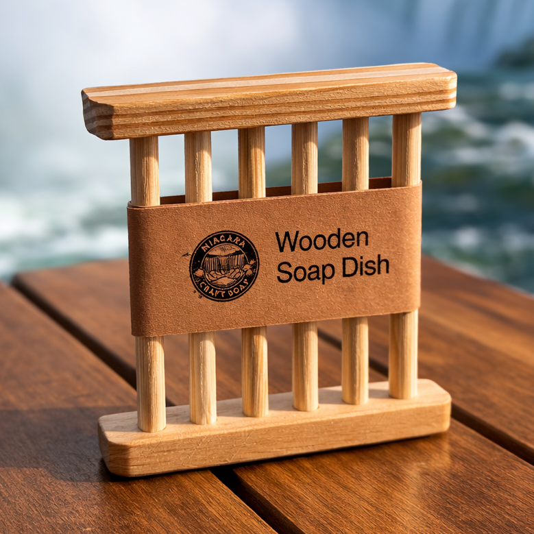 Wooden soap dish with a brand label on a wooden surface in front of Niagara Falls.
