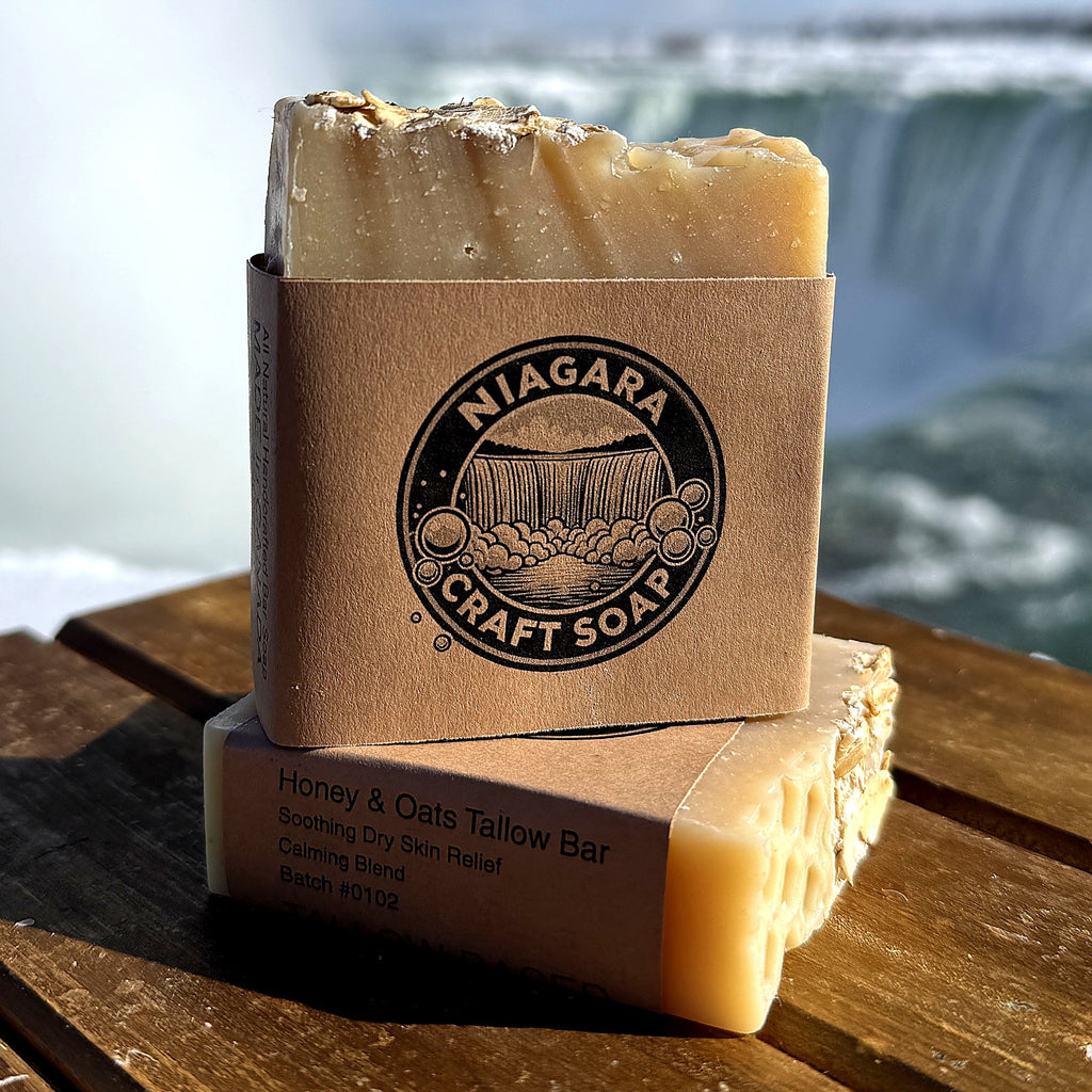 Two bars of soap in front of a scenic waterfall