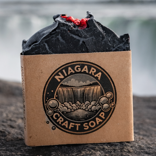 Bar of soap with 'Niagara Craft Soap' packaging in front of a waterfall.