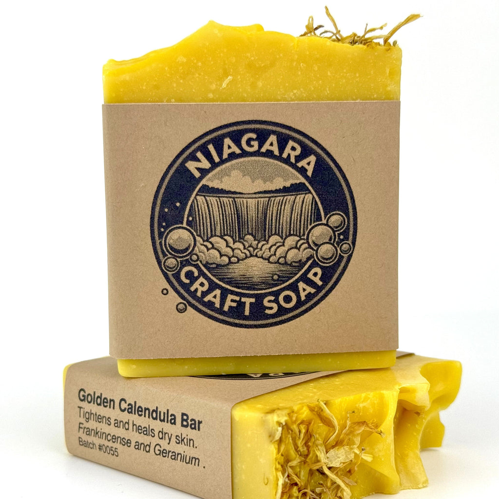Two yellow soap bars with cardboard packaging featuring 'Niagara Craft Soap' on a white background.
