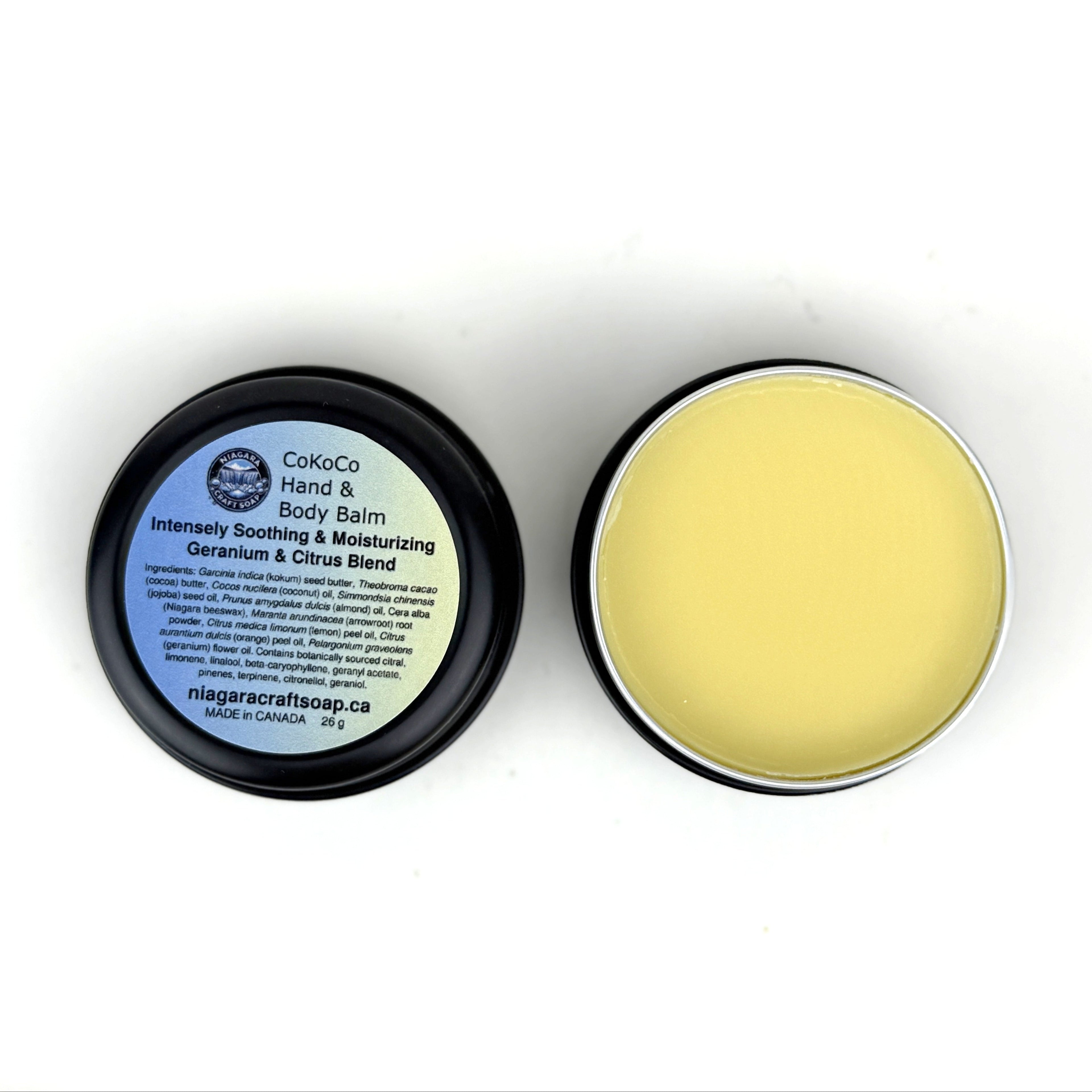 Body balm in a black container with a white label on a white background