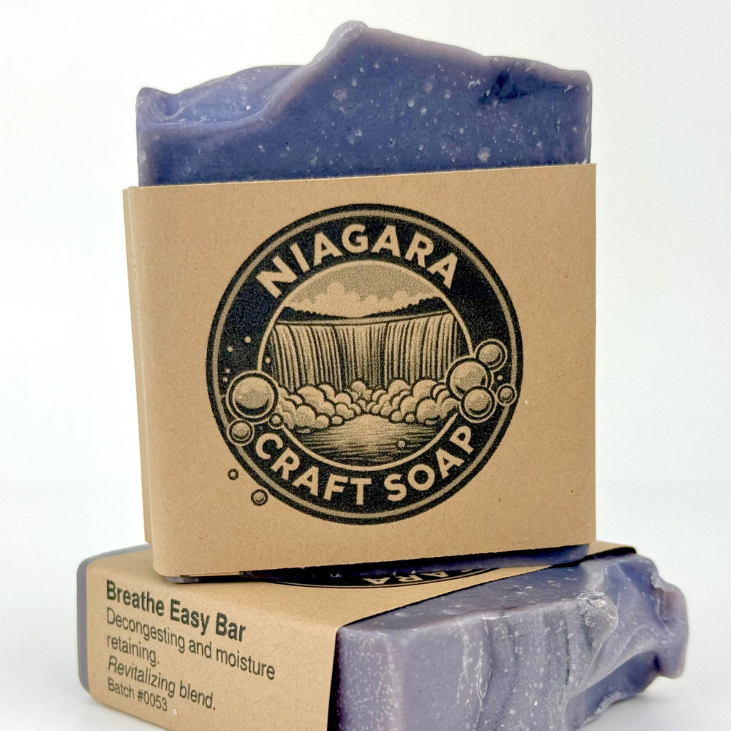 Blue soap bar with 'Niagara Craft Soap' packaging on a white background
