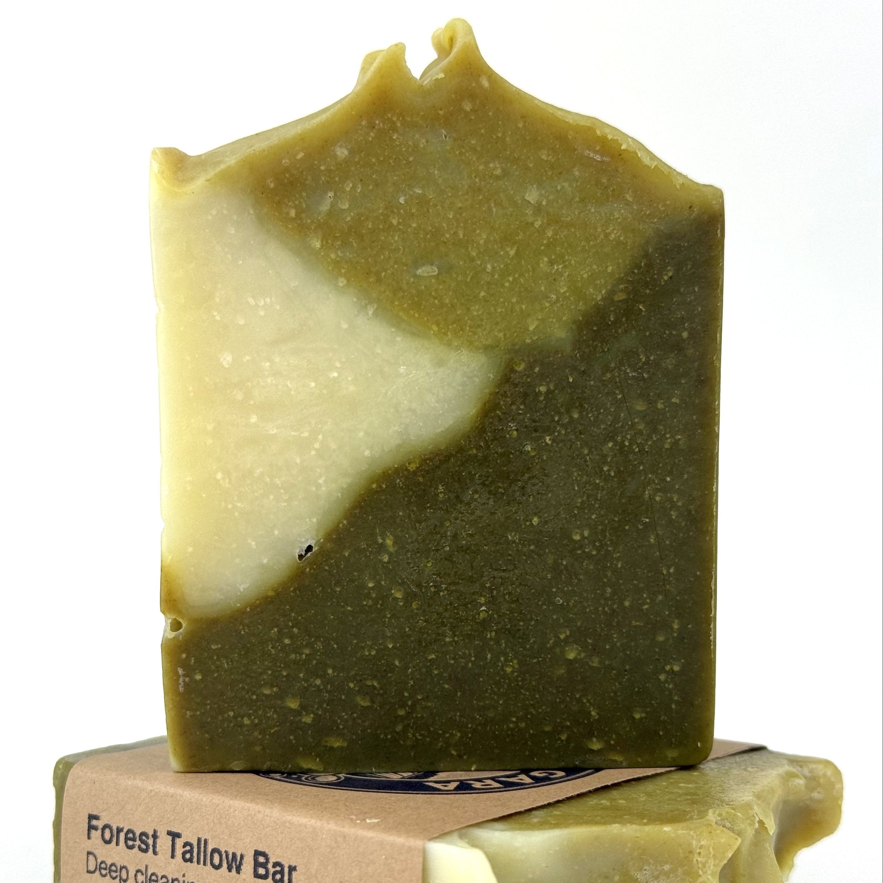 Green soap bar with a visible brand label on a white background